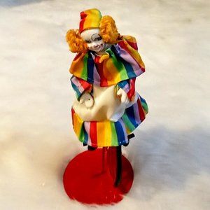 Vintage Porcelain Clown on One Wheel Bike on Stand